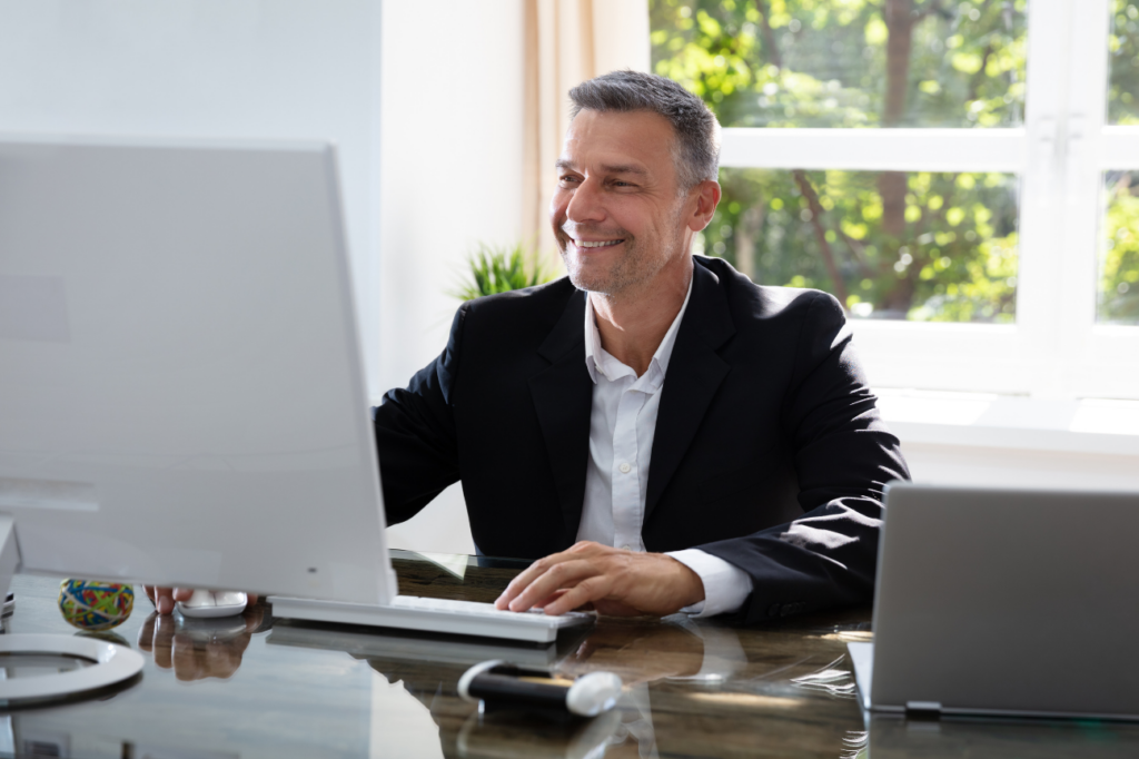 Man looking at this computer